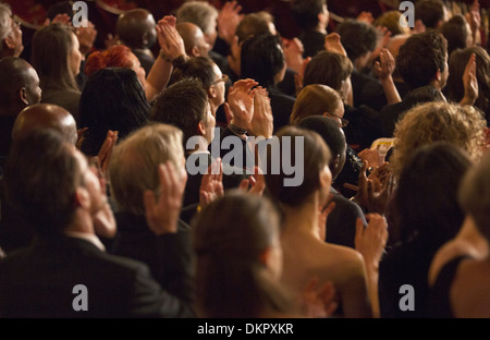 Rear view of clapping theater audience Stock Photo