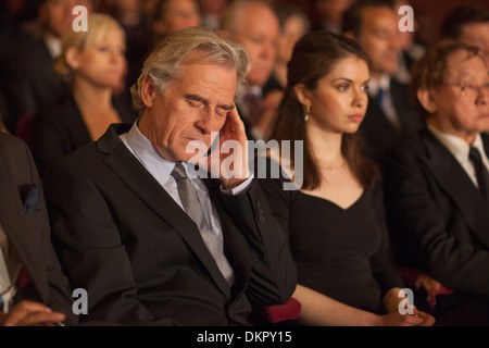 Man sleeping in theater audience Stock Photo
