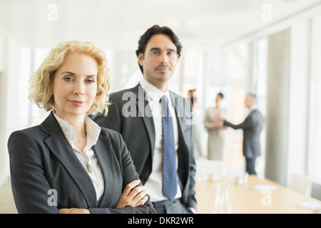 Business people standing in office Stock Photo