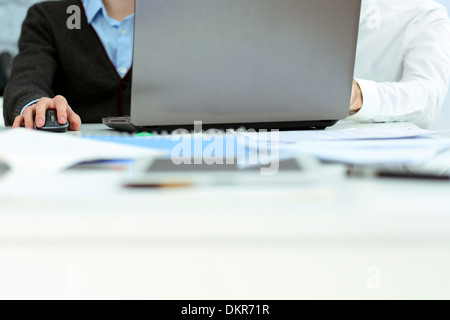 Two businessmen working on laptop in office Stock Photo