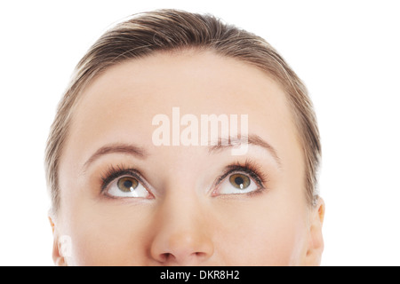 Woman's face, cut out composition. She's looking up. Isolated on white.  Stock Photo