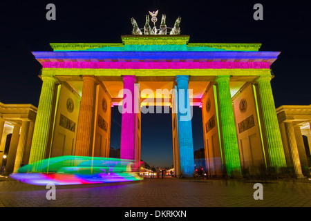 Colored illuminated Brandenburg Gate at night, Berlin, Germany Stock Photo