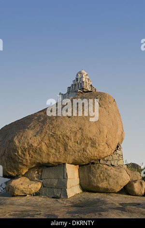 Small hanuman shrine on a boulder at sunset point at Hampi, Karnataka Stock Photo