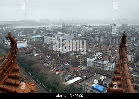 city view of Wuhan in China. High angle shot taken from the historic Yellow Crane Tower in misty ambiance Stock Photo