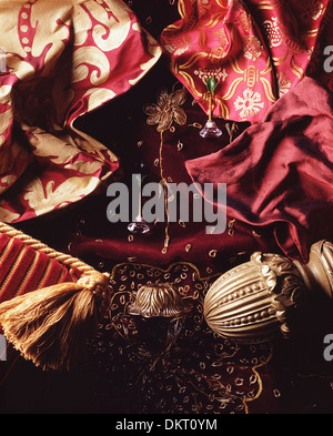 A Christmas tree shape made from fabrics,curtain pole ends,newels,cushions,tassels and crystal knobs used in interior design. Stock Photo
