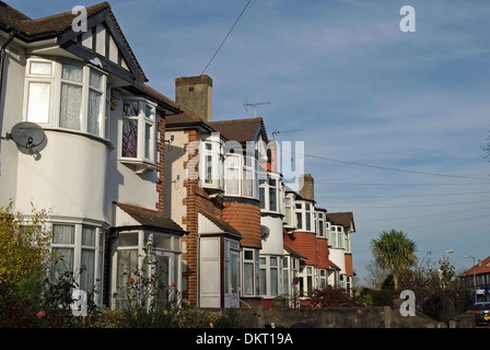 row of 1930s terraced houses with bay windows in twickenham, middlesex, england Stock Photo