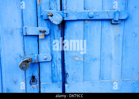 Maidstone, Kent , England. Three padlocks on a painted blue door Stock Photo