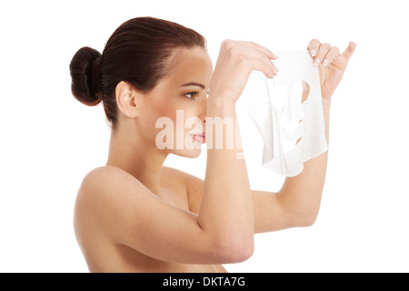 Beautiful woman with collagen mask. Isolated on white.  Stock Photo