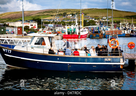Boat with people in a port. Stock Photo