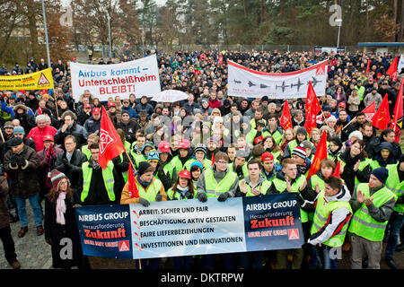 FILE - An archive picture dated 28 November 2013 shows employees of Cassisian, a subsidy of European Aeronautic Defence and Space Company (EADS), protesting against the planned job cuts in front of the factory in Manching, Germany. EADS intends to present details onthe planned restructuring of the company on 09 December 2013, according to employee representatives. Photo: DANIEL KARMANN/dpa Stock Photo