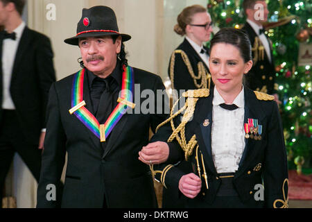 Washington, DC. 8th Dec, 2013. Kennedy Center Honoree Carlos Santana (L) attends a reception at the White House for the 2013 Kennedy Center Honorees on December 8, 2013 in Washington, DC. Credit: Kristoffer Tripplaar / Pool via CNP/dpa/Alamy Live News Stock Photo