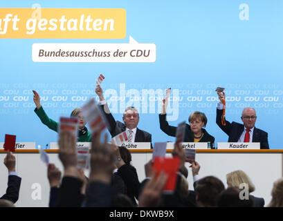 Berlin, Germany. 9th Dec, 2013. German Chancellor Angela Merkel (2nd R) votes for the coalition agreement with the Social Democratic Party (SPD) during a party conference of Germany's Christian Democratic Union (CDU) in Berlin, Germany, on Dec, 9, 2013. Angela Merkel's conservative bloc of CDU voted for the alliance with the center-left Social Democratic Party (SPD) on a small party conference on Monday. © Zhang Fan/Xinhua/Alamy Live News Stock Photo