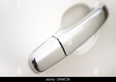 Car Door Handle - White Body Car. Handle Closeup Stock Photo