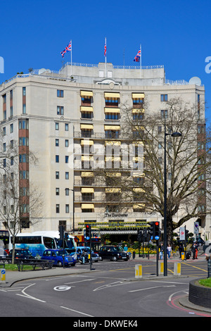 The Dorchester hotel five star prestigious luxury hotel on Park Lane in spring blue sky day in Mayfair London England UK Stock Photo