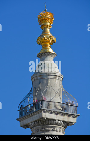 Tourists on the viewing platform at the top of the Monument column commemorating the Great Fire of London Stock Photo