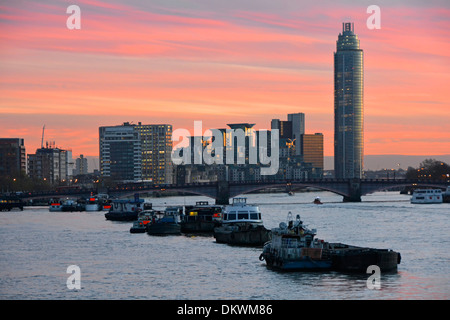 River Thames high tide & sunset view towards Vauxhall Bridge from Westminster St George Wharf Tower block landmark skyscraper apartments London UK Stock Photo