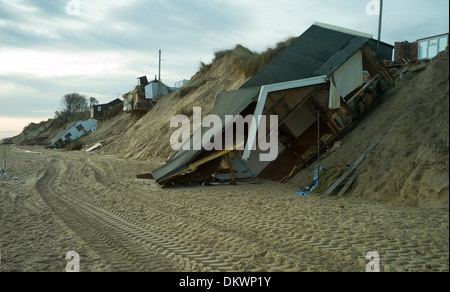 Sea erosion to cliffs at Hemsby Norfolk, England cause bungalow homes to smash into the sea after a tidal surge and gales. Stock Photo