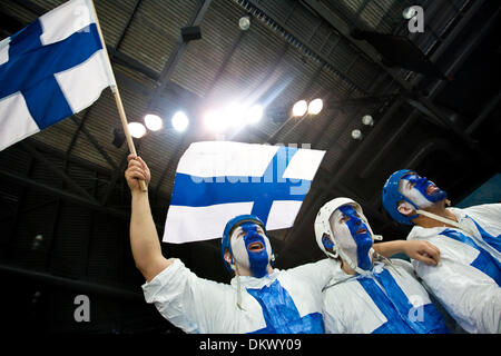 Feb 24, 2010 - Vancouver, British Columbia, Canada - Face painted Finnish fans MARKUS KEKKONEN, HEIKKI MELLA-AHO, and JUSSI KURTTI cheer for their home team during the Men's Hockey game between Finland (FIN) and the Czech Republic (CZE) Wednesday evening in Thunderbird Arena during the 2010 Winter Olympic Games in Vancouver, Canada. Finland defeated Czech 2-0. (Credit Image: © Patr Stock Photo