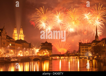 Switzerland Europe fire reflection event canton ZH Zurich New Year's Eve fireworks town city Limmat Grossmünster orange Stock Photo