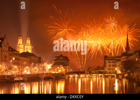 Switzerland Europe fire reflection event canton ZH Zurich New Year's Eve fireworks town city Limmat Grossmünster orange Stock Photo