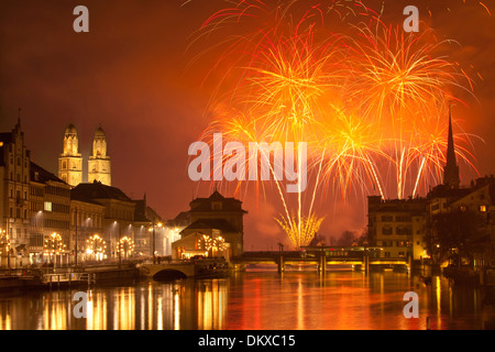 Switzerland Europe fire reflection event canton ZH Zurich New Year's Eve fireworks town city Limmat Grossmünster orange Stock Photo