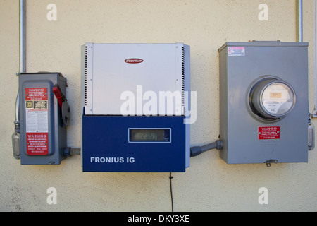 A photo voltaic inverter on side of Green home that is off the grid. Los Angeles, California, USA Stock Photo