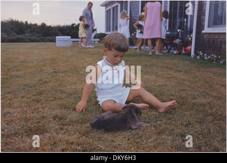 John F. Kennedy Jr. with puppy. Hyannisport, MA, Squaw Island 194256 Stock Photo