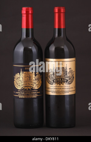 Two bottles of French red wine, first growth Chateau Palmer, Margaux, Bordeaux of year 2003 and second growth Alter Ego 2005 Stock Photo