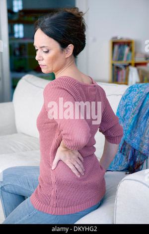 Senior woman with back pain Stock Photo - Alamy