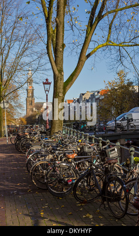 BICYCLES PARKED ON CANAL BRIDGES  AND ALONGSIDE MANY CANALS IN AMSTERDAM HOLLAND Stock Photo