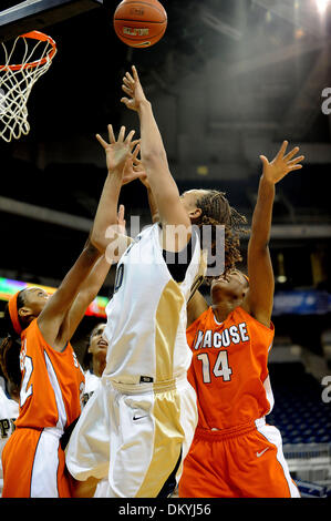 Feb. 02, 2010 - Pittsburgh, PA, U.S - 2 February 2010: University of Pittsburgh sophomore center Shawnice Wilson (40) makes a shot from the baseline while be being defended by Syracuse University senior forward Nicole Michael (32) and Syracuse University sophomore forward Troya Berry (14) in the first half of NCAA Big East women's basketball at the Petersen Events Center in Pittsbu Stock Photo