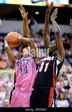 Feb. 14, 2010 - Pittsburgh, PA, U.S - 14 February 2010: University of Pittsburgh junior guard Jania Sims (14) goes for two as University of Louisville junior center Keshia Hines (45) and University of Louisville freshman forward Asia Taylor (31) defend under the basket in the first half of NCAA women's Big East basketball action at the Petersen Events Center in Pittsburgh, PA...The Stock Photo