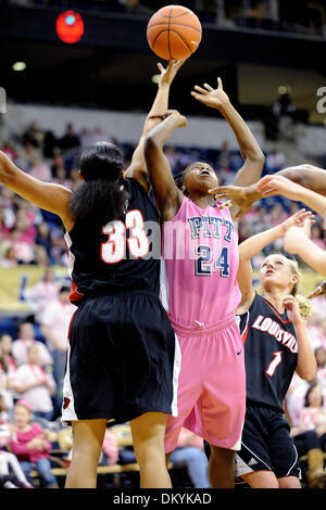 Feb. 14, 2010 - Pittsburgh, PA, U.S - 14 February 2010: University of Pittsburgh sophomore guard Sarah Ogoke (24) has the ball stripped away as she goes for two by University of Louisville sophomore forward Monique Reid (33) of NCAA women's Big East basketball action at the Petersen Events Center in Pittsburgh, PA...The Pitt Panthers players are wearing pink uniforms to help promot Stock Photo