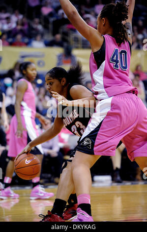 Feb. 14, 2010 - Pittsburgh, PA, U.S - 14 February 2010: University of Louisville sophomore forward Monique Reid (33) works the baseline as University of Pittsburgh sophomore center Shawnice Wilson (40) defends in the second half of NCAA women's Big East basketball action at the Petersen Events Center in Pittsburgh, PA...The Pitt Panthers players are wearing pink uniforms to help pr Stock Photo