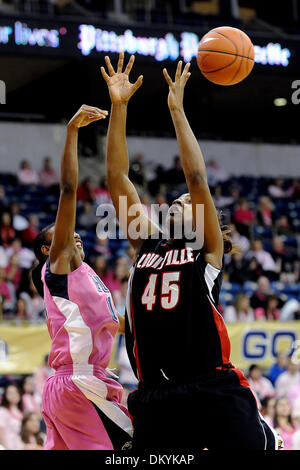 Feb. 14, 2010 - Pittsburgh, PA, U.S - 14 February 2010: University of Louisville junior center Keshia Hines (45) has her rebound knocked away by University of Pittsburgh junior guard Jania Sims (14) in the second half of NCAA women's Big East basketball action at the Petersen Events Center in Pittsburgh, PA...The Pitt Panthers players are wearing pink uniforms to help promote breas Stock Photo