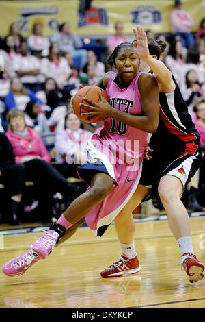 Feb. 14, 2010 - Pittsburgh, PA, U.S - 14 February 2010: University of Pittsburgh junior guard Taneisha Harrison (10) drives the baseline as University of Louisville sophomore guard Becky Burke (11) tries to defend in the first half of NCAA women's Big East basketball action at the Petersen Events Center in Pittsburgh, PA...The Pitt Panthers players are wearing pink uniforms to help Stock Photo