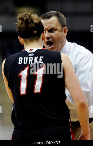 Feb. 14, 2010 - Pittsburgh, PA, U.S - 14 February 2010: University of Louisville head coach Jeff Walz voices his displeasure of University of Louisville sophomore guard Becky Burke's (11) level of play in the second half of NCAA women's Big East basketball action against the University of Pittsburgh at the Petersen Events Center in Pittsburgh, PA...The Pitt Panthers players are wea Stock Photo