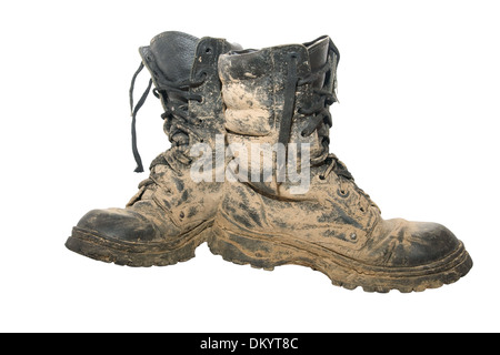 A pair of dirty hiking boots isolated over white Stock Photo