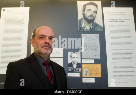 Cottbus, Germany. 10th Dec, 2013. Priest Matthias Storck satnds in front of the part of the exhibition which tells his story as former prisoner at Cottbus prison at the opening of the new permanent exhibition of the Centre for Human Rights Cottbus in the former prison complex in Cottbus, Germany, 10 December 2013. The exhibition is titled 'Chequered clouds - political imprisonment in prison Cottbus from 1933 till 1989'. Photo: PATRICK PLEUL/dpa/Alamy Live News Stock Photo