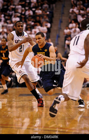 Feb. 22, 2010 - Hartford, Connecticut, U.S - 22 February 2010: West Virginia's Joe Mazzulla (21) breaks through the defense of Connecticut's Stanley Robinson (21) during game action in the first half. Connecticut defeated #7 West Virginia 73 - 62  at the XL Center in Hartford, Connecticut. (Credit Image: © Geoff Bolte/Southcreek Global/ZUMApress.com) Stock Photo