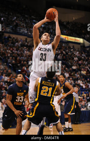 Feb. 22, 2010 - Hartford, Connecticut, U.S - 22 February 2010: Connecticut's Gavin Edwards (33) shoots over West Virginia's Joe Mazzulla (21) during game action in the first half. Connecticut defeated #7 West Virginia 73 - 62  at the XL Center in Hartford, Connecticut. Edwards was called for the charge on the play. (Credit Image: © Geoff Bolte/Southcreek Global/ZUMApress.com) Stock Photo