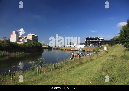 Narrowboats moored on the river Weaver waiting to go up the Anderton Lift at Winnington, Northwich opposite the Tata works Stock Photo