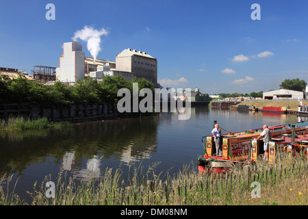 Narrowboats moored on the river Weaver waiting to go up the Anderton Lift at Winnington, Northwich opposite the Tata works Stock Photo