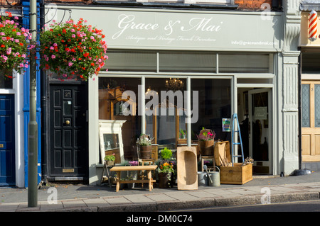 Furniture on the pavement outside the shop of Grace & Mai Antique and Vintage French Furniture in Sundridge Park, Kent. Stock Photo