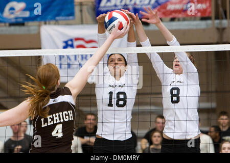 Nov. 21, 2009 - West Point, New York, U.S - 21 November 2009:  Army's Deborah Frantz and Ann Recht block Lehigh's Emily Flanagan during game action at the Patriot League Volleyball CHampionship Semi-Finals at Gillis Field House in West Point, NY.  The Army Black Knights defeated Lehigh 3-0, while the American University Eagles defeated the Colgate Raiders3-0.  Mandatory Photo Credi Stock Photo