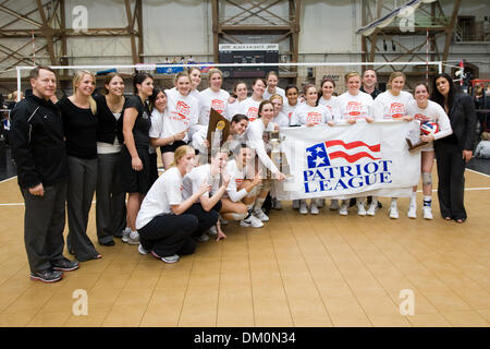 Nov. 22, 2009 - West Point, New York, U.S - 22 November 2009:  Army Black Knights pose with the championship tropgy and the league banner after the Patriot League Volleyball Campionship Finals at Gillis Field House in West Point, NY.  The Army Black Knights defeated the defending champion American University Eagles 3-0, securing the program's first-ever bid to the NCAA Tournament.  Stock Photo