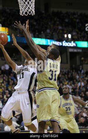 Georgia Tech forward Gani Lawal (31) shoots over Maryland forward Dino ...