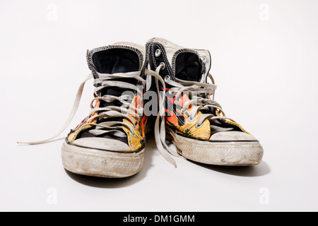 Worn and dirty Converse All Star shoes isolated on white background Stock Photo