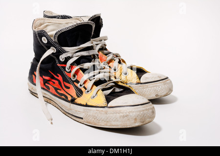 Worn and dirty Converse All Star shoes isolated on white background Stock Photo