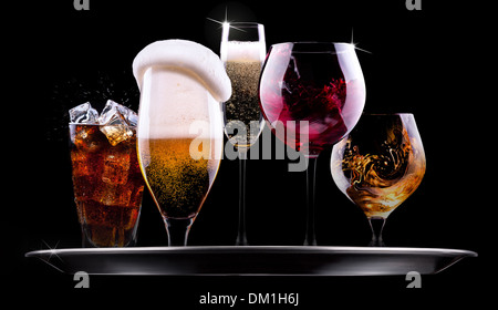 tray with different drinks on black background - champagne, beer, cocktail, wine, brandy, whiskey, scotch, vodka, cognac Stock Photo